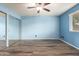 Bedroom with wood-look flooring and a mirrored closet at 3010 E Cortez St, Phoenix, AZ 85028