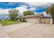 Single story home with a two car garage and an extra parking area at 3010 E Cortez St, Phoenix, AZ 85028