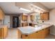 Well-lit kitchen boasts ample counter space, wooden cabinetry, and modern appliances at 3010 E Cortez St, Phoenix, AZ 85028