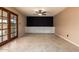 Bright living room featuring neutral tones, tile flooring, and a stylish ceiling fan at 3010 E Cortez St, Phoenix, AZ 85028