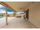 Covered patio space complete with a ceiling fan, mounted television, and a view of the backyard and pool at 3010 E Cortez St, Phoenix, AZ 85028