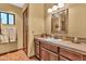 This bathroom features a vanity with a tile countertop and framed mirror at 3027 N Nebraska St, Chandler, AZ 85225