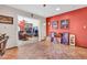 Welcoming entryway with ceramic tile flooring, red accent wall, and view into the living room at 3027 N Nebraska St, Chandler, AZ 85225