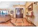 Charming foyer featuring tile flooring, decorative mirror, console table and an inviting entrance to the home at 3027 N Nebraska St, Chandler, AZ 85225