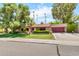 Well maintained single-story home with a lush green lawn and mature shade trees at 3027 N Nebraska St, Chandler, AZ 85225