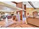 Open-concept living area with exposed beams, tile flooring, open bar and seamless flow, great for entertaining at 3027 N Nebraska St, Chandler, AZ 85225