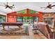 Bright living room with open layout, vaulted ceiling, fireplace, and access to backyard at 3027 N Nebraska St, Chandler, AZ 85225
