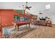 Spacious living area with wood floors, a stone fireplace, and a pool table for entertainment at 3027 N Nebraska St, Chandler, AZ 85225