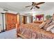 Spacious main bedroom features a ceiling fan, en suite bathroom, and a large wardrobe at 3027 N Nebraska St, Chandler, AZ 85225