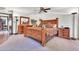 Comfortable main bedroom features a carved wood bed, wooden dressers, and decorative accents at 3027 N Nebraska St, Chandler, AZ 85225