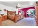 Spacious main bedroom features carved wood bed, en suite bathroom, and sitting area with fireplace at 3027 N Nebraska St, Chandler, AZ 85225