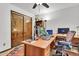 This office features a large desk area, wood cabinets, and a closet at 3027 N Nebraska St, Chandler, AZ 85225