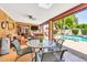 Covered patio featuring comfortable seating, outdoor dining area, and seamless access to the pool at 3027 N Nebraska St, Chandler, AZ 85225