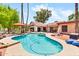 Beautiful backyard pool with mature trees, outdoor seating, and well-maintained landscaping at 3027 N Nebraska St, Chandler, AZ 85225