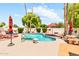Private pool area surrounded by lush landscaping, seating, and shade, ideal for outdoor enjoyment at 3027 N Nebraska St, Chandler, AZ 85225