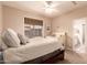 Bedroom with neutral decor, a ceiling fan, a window view, a walk-in closet, and a crib at 3055 N Red Mountain -- # 98, Mesa, AZ 85207