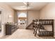 Bedroom with neutral colors, bunkbeds with a slide, a window with view, and a ceiling fan at 3055 N Red Mountain -- # 98, Mesa, AZ 85207