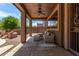 Relaxing covered patio with ceiling fan, outdoor seating, and a view of the backyard at 3055 N Red Mountain -- # 98, Mesa, AZ 85207