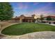 Large, well-maintained yard featuring lush lawn and outdoor entertainment spaces at 306 E Sarah Ln, Tempe, AZ 85284