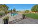 Backyard features a diving pool, umbrellas and beautiful landscaping, creating a serene outdoor retreat at 306 E Sarah Ln, Tempe, AZ 85284