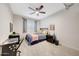Bedroom features a ceiling fan, gray curtains, nightstand, and carpeted floors at 306 E Sarah Ln, Tempe, AZ 85284