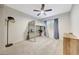 Bedroom with a loft bed, desk, ceiling fan and neutral-colored carpet at 306 E Sarah Ln, Tempe, AZ 85284