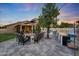 Outdoor kitchen and patio, featuring built in grill, sink, cooking surface, bar seating, and a lounge at 306 E Sarah Ln, Tempe, AZ 85284