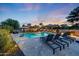 A stunning outdoor pool area with lounge chairs and umbrellas, perfect for relaxation and entertaining at 306 E Sarah Ln, Tempe, AZ 85284