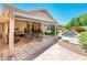 Beautiful backyard featuring a patio, outdoor seating, a waterfall, and a spa at 30844 N 41St Pl, Cave Creek, AZ 85331