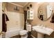 Bathroom with wooden floors, a pedestal sink, decorative lighting, and shower with curtain at 30844 N 41St Pl, Cave Creek, AZ 85331