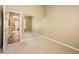 Bedroom with sliding mirror closet, carpet, and entry way with view to the dining room at 30844 N 41St Pl, Cave Creek, AZ 85331