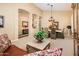 Open dining room area featuring neutral tones, elegant furnishings, and decorative archways at 30844 N 41St Pl, Cave Creek, AZ 85331