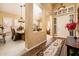 Inviting entryway leading to dining room with plantation shutters and stylish decor providing seamless flow at 30844 N 41St Pl, Cave Creek, AZ 85331
