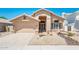 Charming single-story home with a well-manicured desert landscape, three car garage, and neutral color palette at 30844 N 41St Pl, Cave Creek, AZ 85331