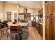 Spacious kitchen with wood cabinets, granite countertops, stainless steel appliances, and an island with bar seating at 30844 N 41St Pl, Cave Creek, AZ 85331