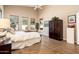 Bright main bedroom featuring wood-look flooring, a ceiling fan, and windows offering ample natural light at 30844 N 41St Pl, Cave Creek, AZ 85331