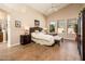 Relaxing main bedroom with natural light, ceiling fan, ensuite, and wood-look flooring at 30844 N 41St Pl, Cave Creek, AZ 85331
