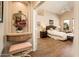 Main bedroom showcasing wood-look floors, a ceiling fan, and an ensuite bath at 30844 N 41St Pl, Cave Creek, AZ 85331