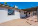 Back of home showing covered patio, mature landscaping and backyard at 3118 S Los Altos Dr, Mesa, AZ 85202