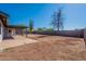 View of covered patio and expansive backyard with mature trees and landscaping at 3118 S Los Altos Dr, Mesa, AZ 85202