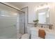 Updated bathroom featuring a glass enclosed shower, vanity with plant decor, and fixtures at 3118 S Los Altos Dr, Mesa, AZ 85202