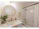 Clean bathroom with gold hardware, shower/tub combo, and white vanity at 3118 S Los Altos Dr, Mesa, AZ 85202