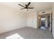 Carpeted bedroom with closets and access to en-suite bathroom at 3118 S Los Altos Dr, Mesa, AZ 85202