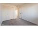 Cozy bedroom with closet, neutral walls, and carpet flooring at 3118 S Los Altos Dr, Mesa, AZ 85202
