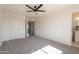 Carpeted bedroom with multiple closets and an attached bathroom at 3118 S Los Altos Dr, Mesa, AZ 85202