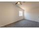 Bright bedroom with neutral walls, plush carpet, and a window for natural light at 3118 S Los Altos Dr, Mesa, AZ 85202