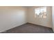 Bedroom featuring neutral walls, carpet, and window for natural light at 3118 S Los Altos Dr, Mesa, AZ 85202