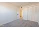 Bright bedroom with white walls, neutral carpet, and ensuite access to bathroom at 3118 S Los Altos Dr, Mesa, AZ 85202