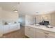 Open kitchen with white cabinets, quartz countertops, and a view into the dining area at 3118 S Los Altos Dr, Mesa, AZ 85202