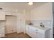 Kitchen with white cabinets, stone countertops, stylish hardware, and neutral subway tile backsplash at 3118 S Los Altos Dr, Mesa, AZ 85202